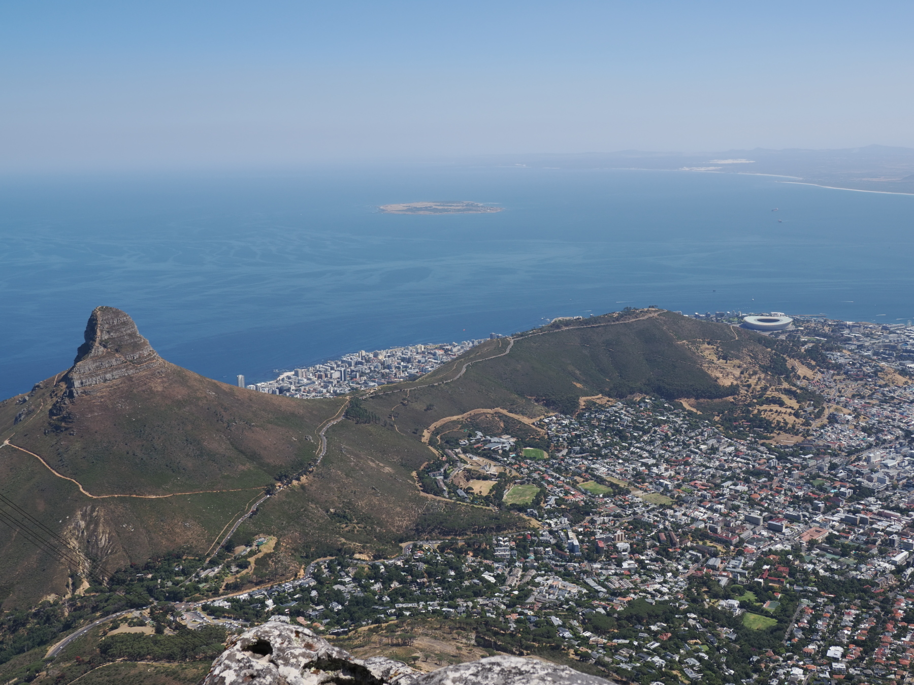 View of Lion's Head, Signal hill from Table Mountain. Lots of people walk up Lion peak for exercise