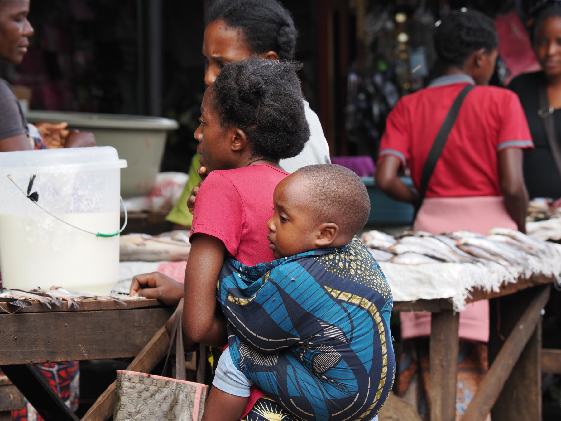 Chitenge in use as a baby carrier. We saw lots of these