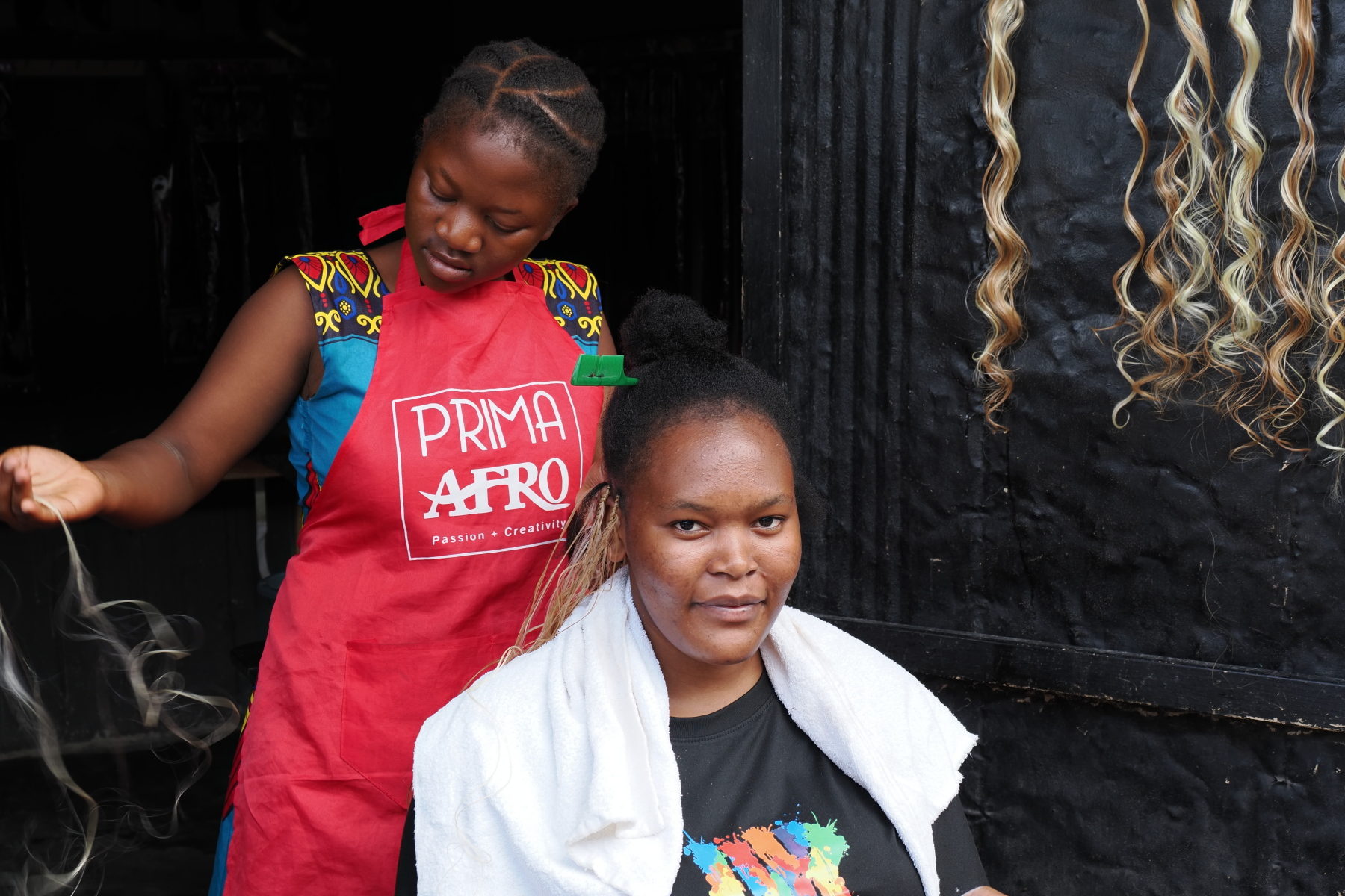There was a complete alley of hairdressers in the market. Braiding extra long braids into hair is all the rage at the moment. 