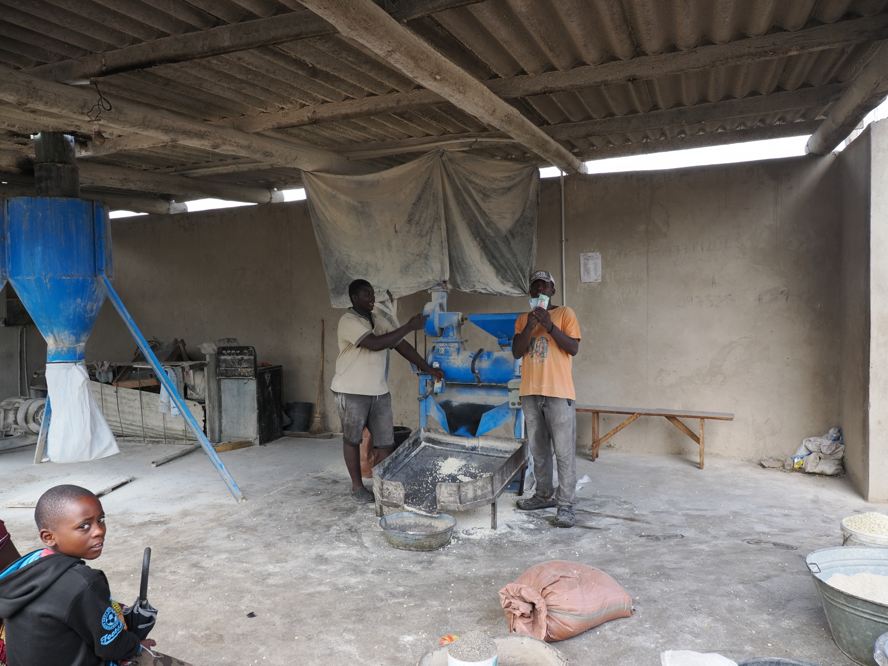 traditionally, corn/ millet were pounded using a mortar and pestle. Grinders are available in the market. 