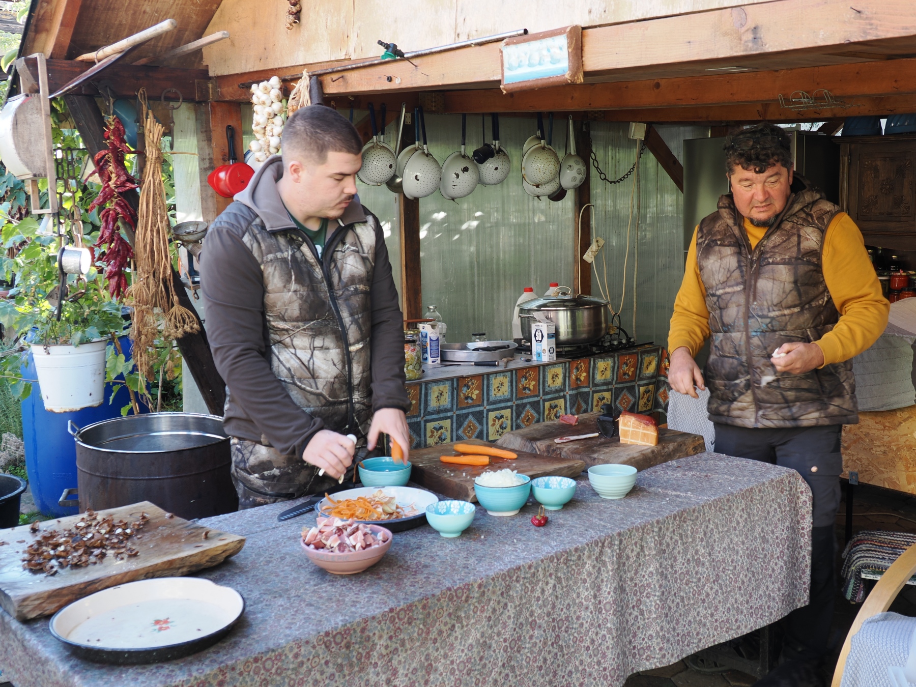 Steven and Denis cutting vegetables for the beans